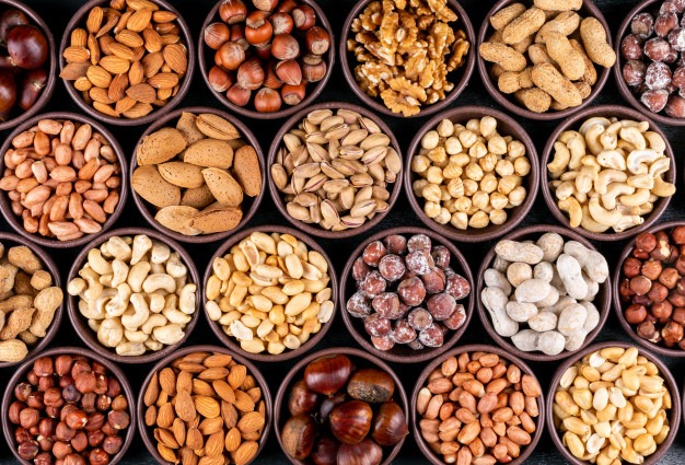 set-pecan-pistachios-almond-peanut-cashew-pine-nuts-lined-up-assorted-nuts-dried-fruits-mini-different-bowls_176474-2051
