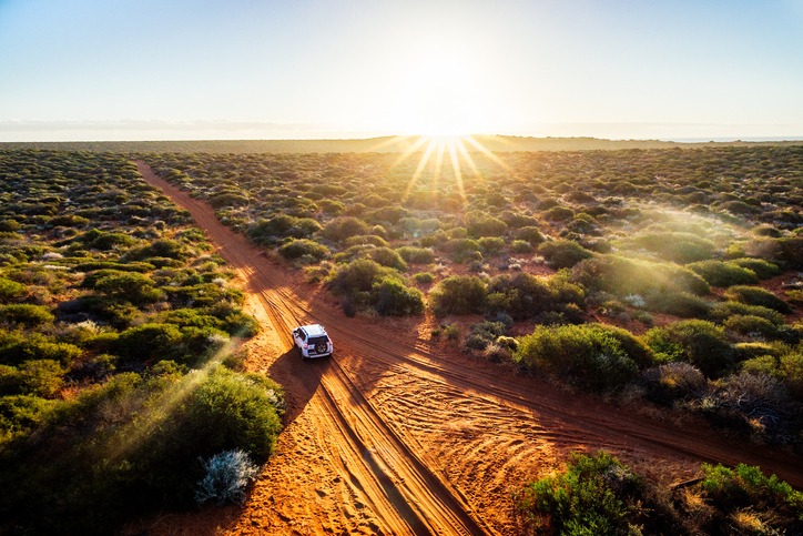 Driving off-road in Western Australia at sunset