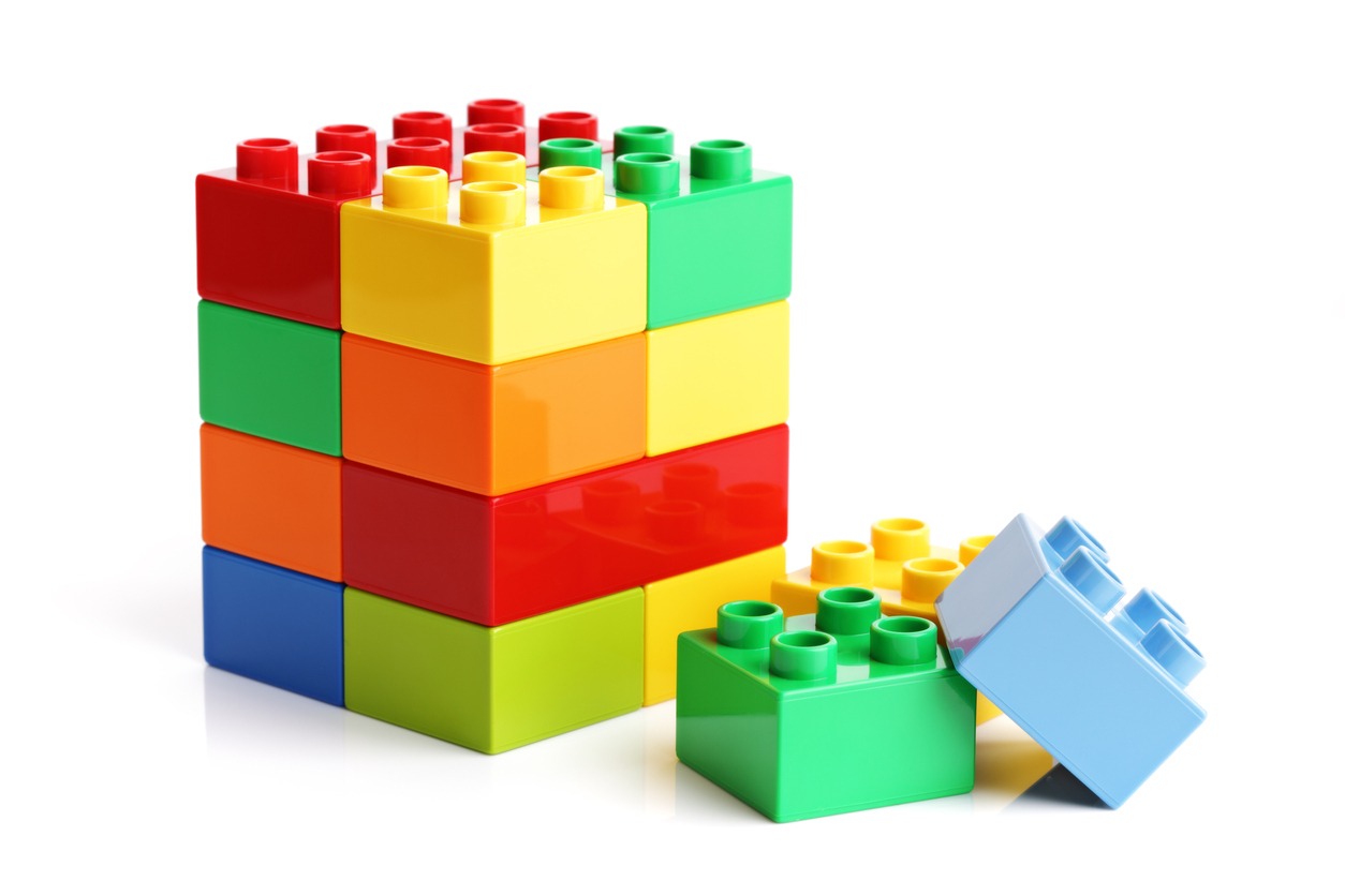 Lego puzzle multicolored building blocks on a white background