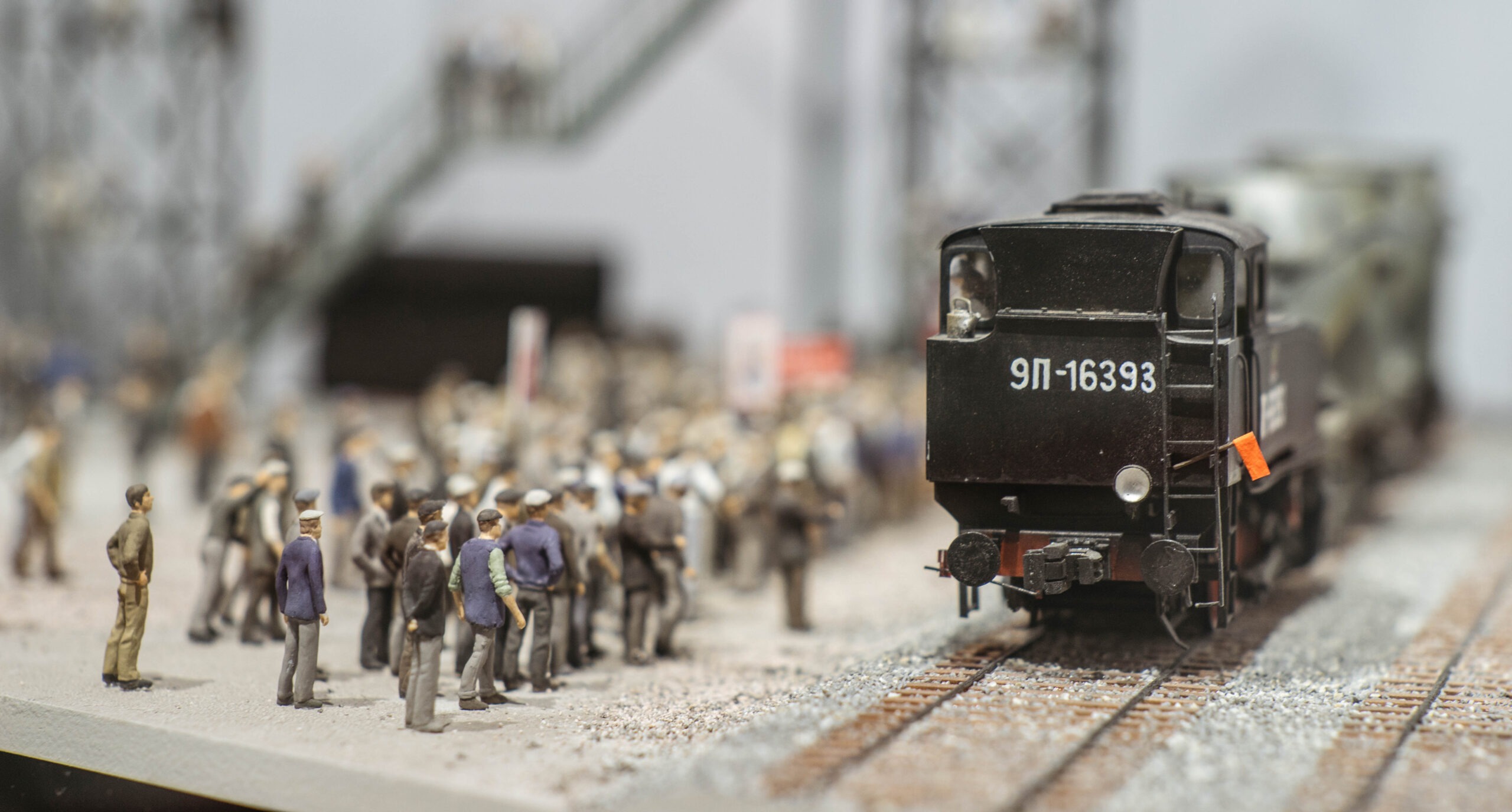 model train with miniature crowd